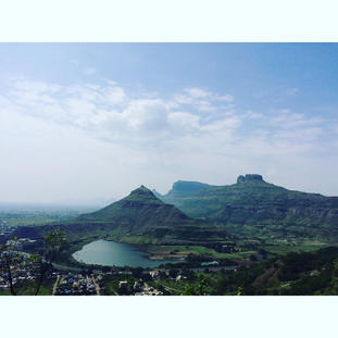 Mountains, pond & blue sky